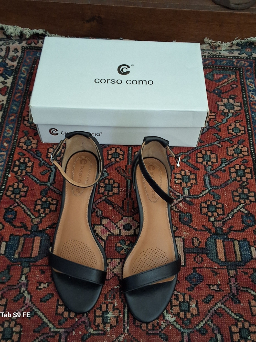 Corso Como Black Leather Ankle-Strap Sandals. Milan-based.